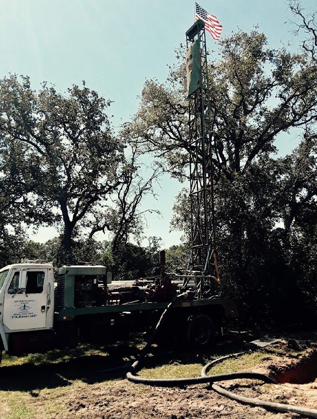 residential water tower next to company truck